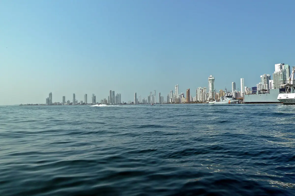 The Bocagrande skyline seen low across blue water from a boat on the bay